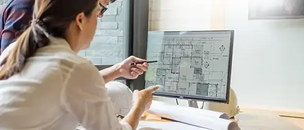 Two people looking at a schedule 